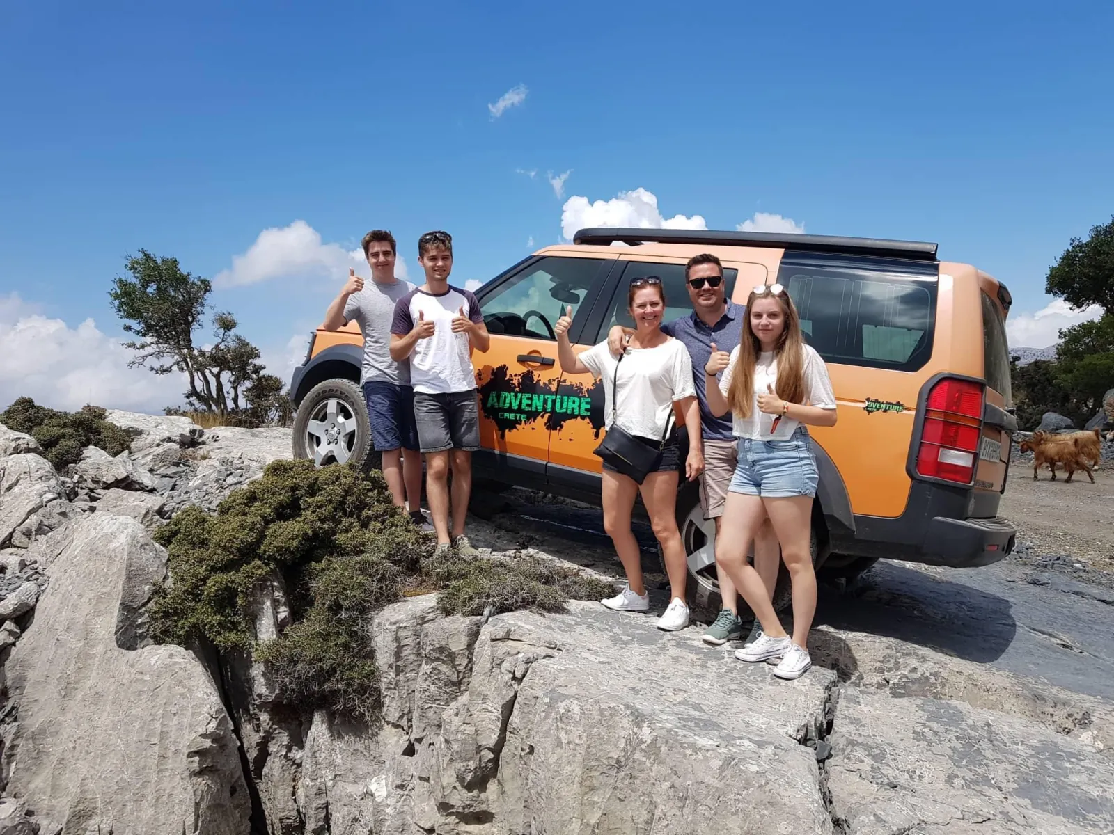 Guests beside the Land Rover on the rocky track up to Lassithi