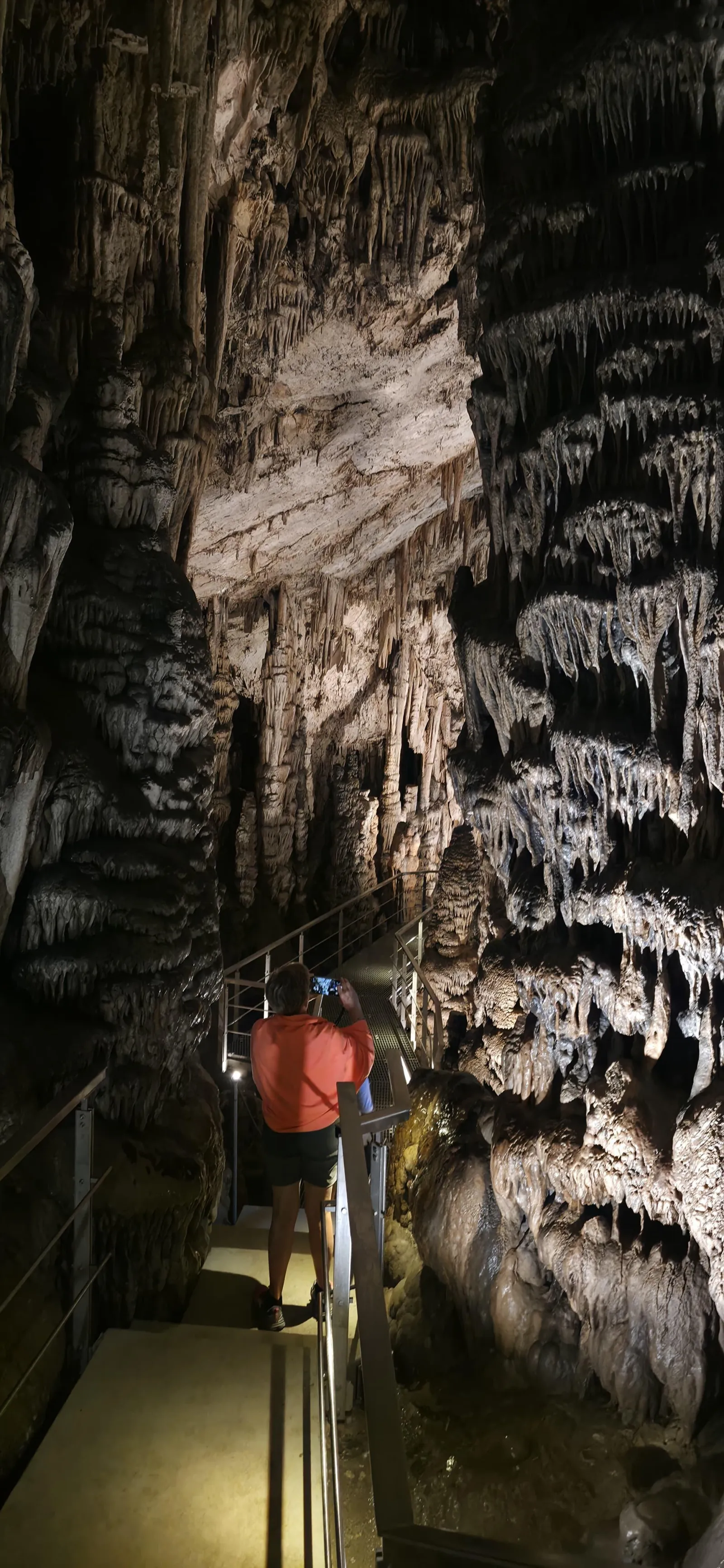 Lit stalactite formations on the descent into the Psychro Cave