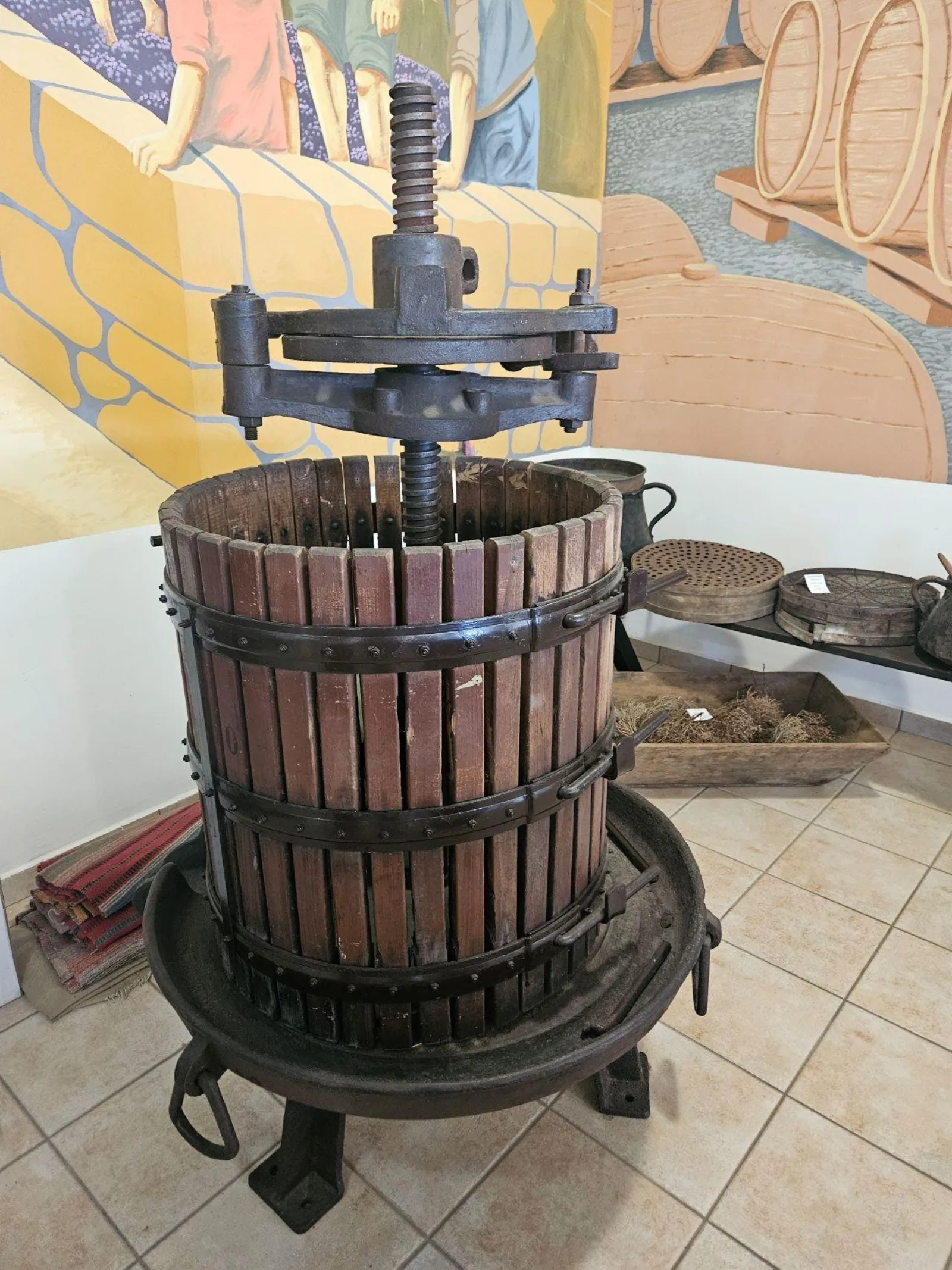 A traditional basket press of the kind used before centrifugal milling