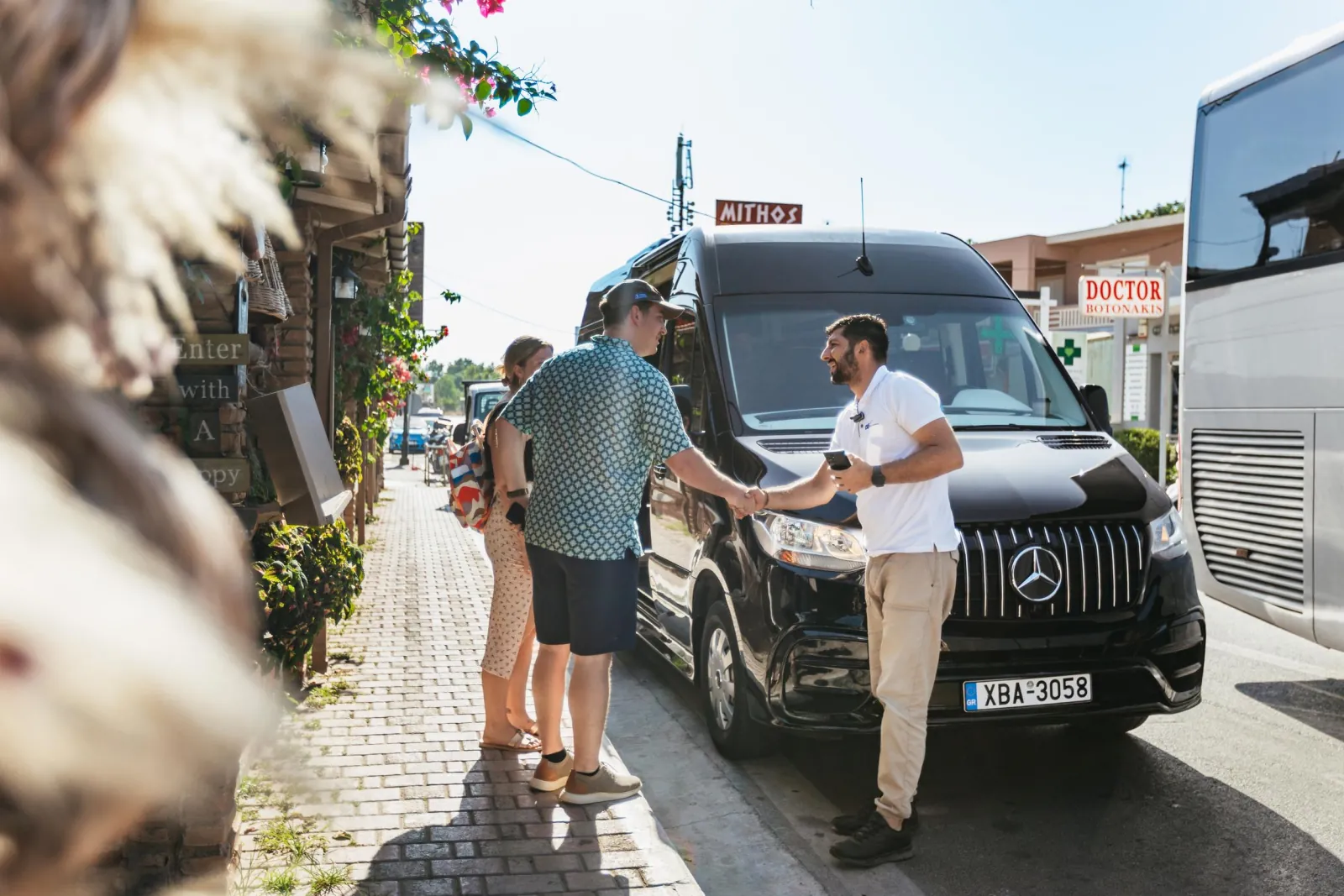 The tour minibus collecting guests from a Chania pickup point